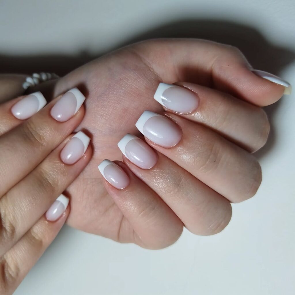 Elegant milky French nails with soft creamy tips, perfect for a timeless and sophisticated look.